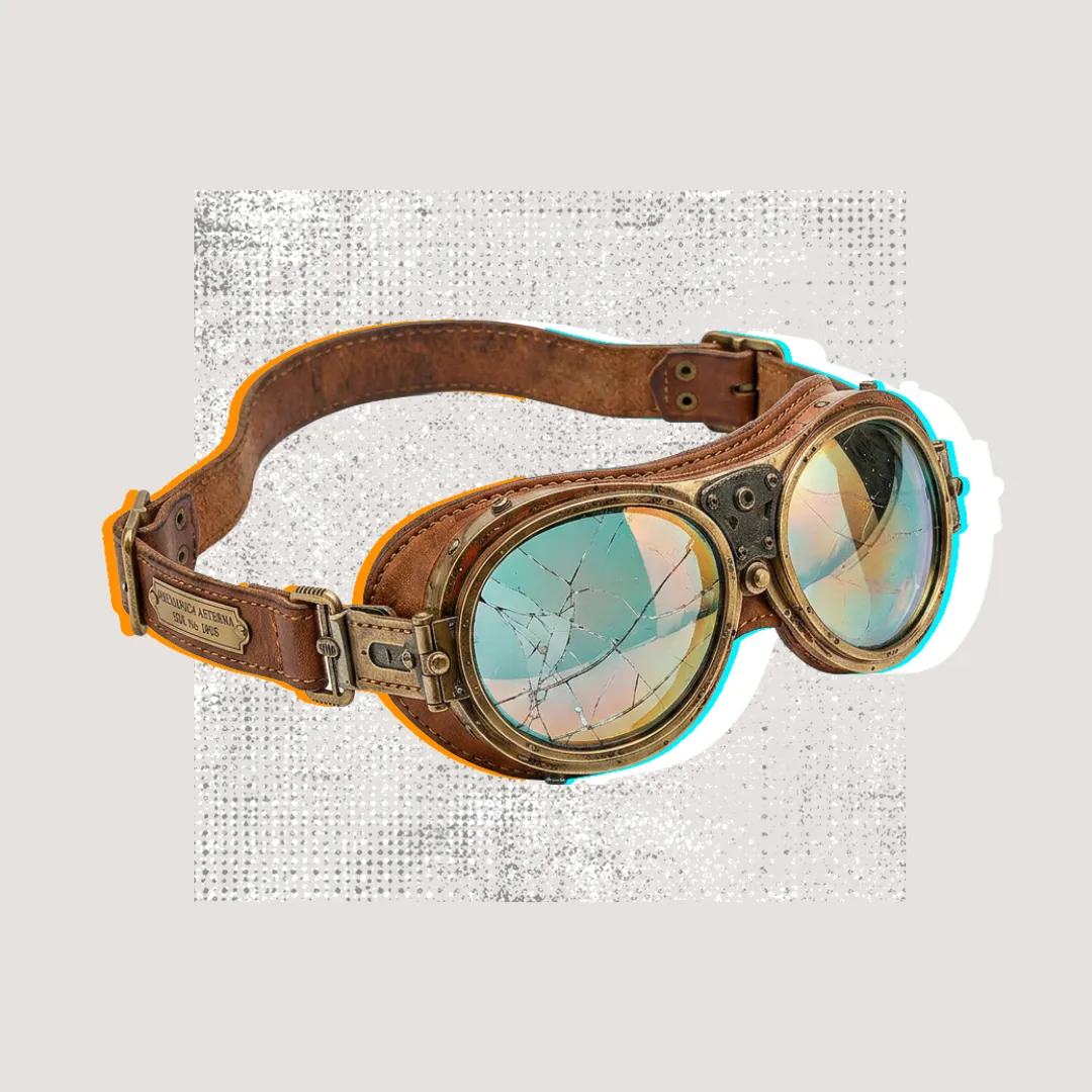 Abgenutzte Fliegerbrille mit gesprungenem Glas, die Marke durch eine verzerrte Linse gesehen.